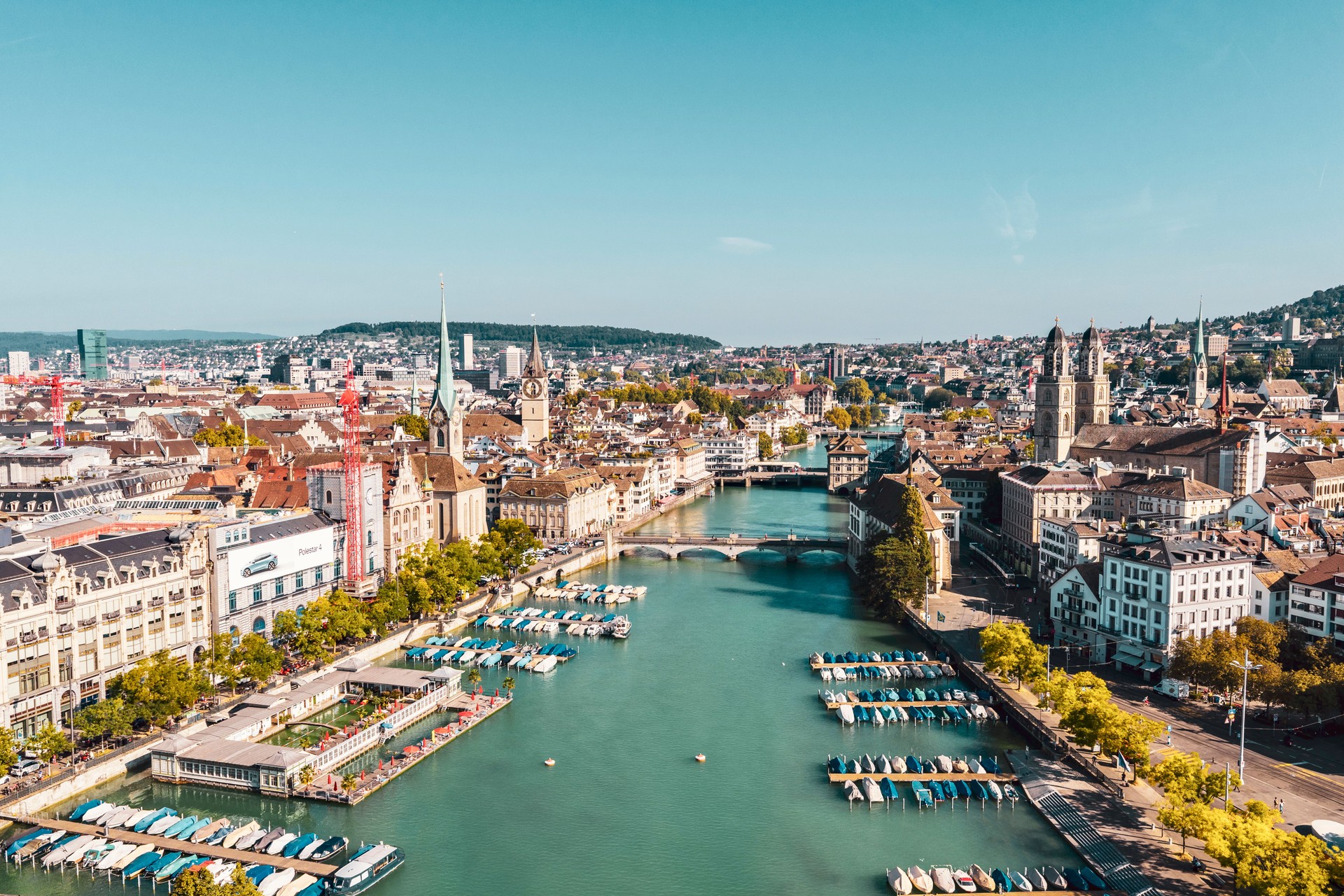 Skyline of Zurich with the River Limmat and Grossmünster sunny summer day Skyline of Zurich with the River Limmat and Grossmünster sunny summer day